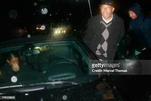 Entrepreneur Russell Simmons and galpal model Porschia Coleman leave Mr Chow's restaurant in Beverly Hills on February 21, 2008 in Los Angeles,...