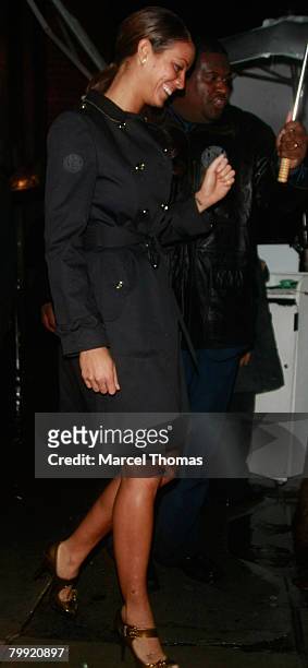 Entrepreneur Russell Simmons and galpal model Porschia Coleman leave Mr Chow's restaurant in Beverly Hills on February 21, 2008 in Los Angeles,...