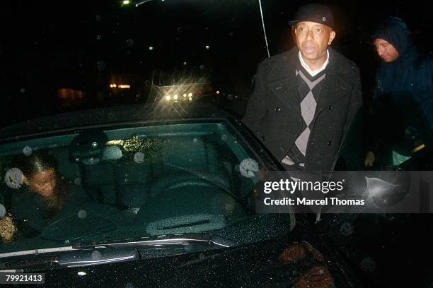 Entrepreneur Russell Simmons and galpal model Porschia Coleman leave Mr Chow's restaurant in Beverly Hills on February 21, 2008 in Los Angeles,...