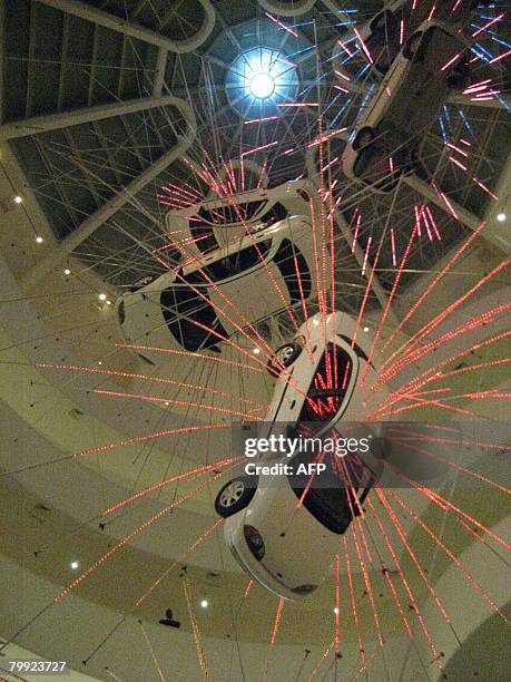 By James Hossack This February 21, 2008 photo shows a car piece entitled "Inopportune: Stage One" at the Guggenheim Museum in New York. Works by...