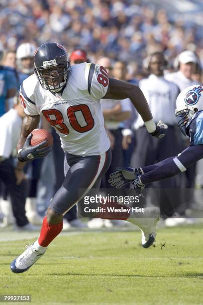 Houston Texan wide receiver Andre Johnson avoids the tackle of a Tennessee Titans defender during a 20 to 10 win over the Tennessee Titans on October...