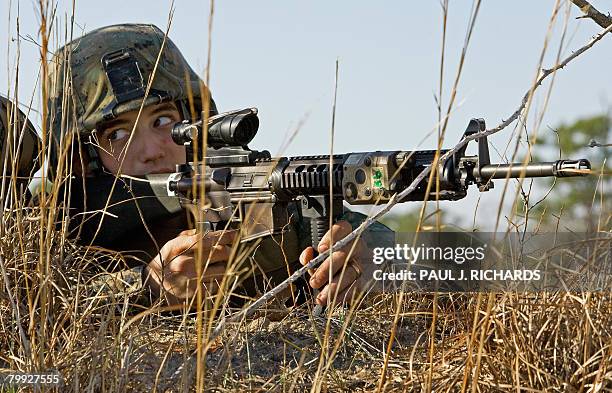 Marine Corps Private First Class Justin Jones, 20 years old, from Lima, Ohio who has never been deployed before, practices helicopter landing zone...