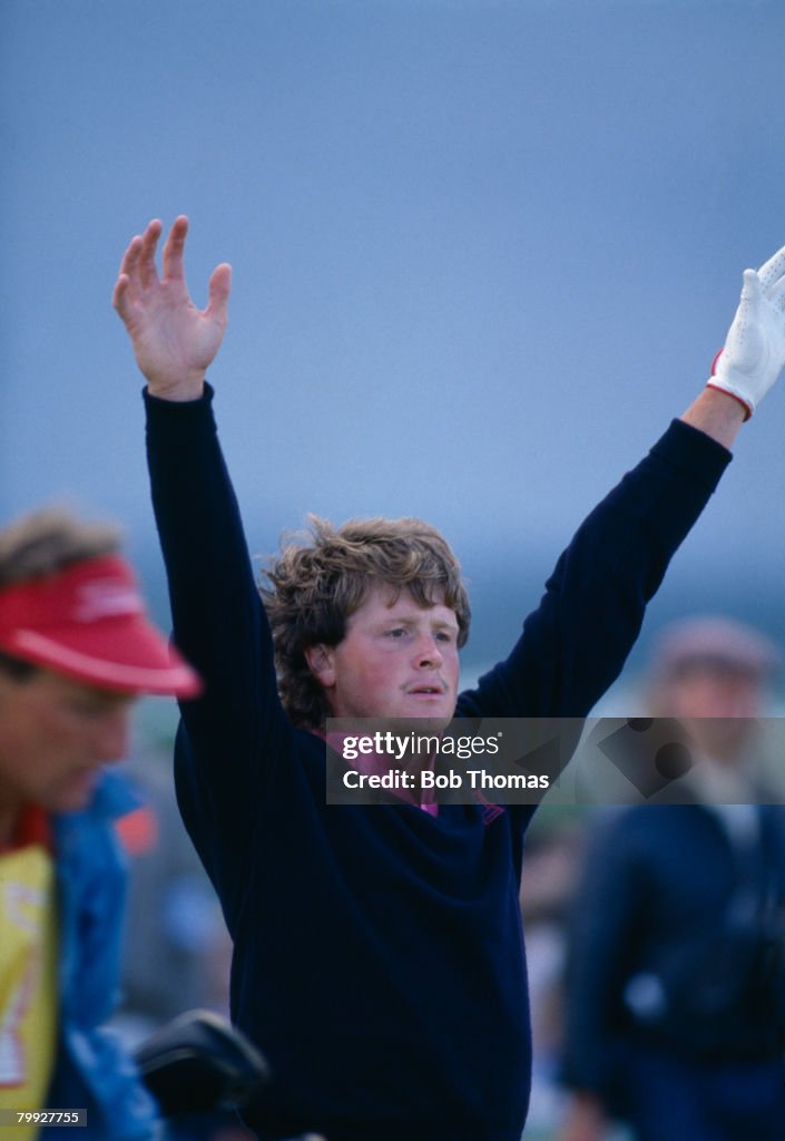 Australian golfer Wayne Riley raises his arms during the British Open ...