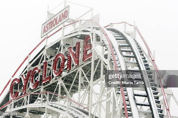 Snow blankets the Coney Island Cyclone roller coaster during a morning snow storm February 22, 2008 in the Brooklyn borough of New York City. A...