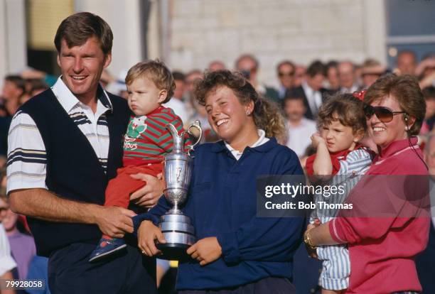 English golfer Nick Faldo celebrates with his family and caddie Fanny Sunesson after winning the British Open Golf Tournament held at St Andrews,...