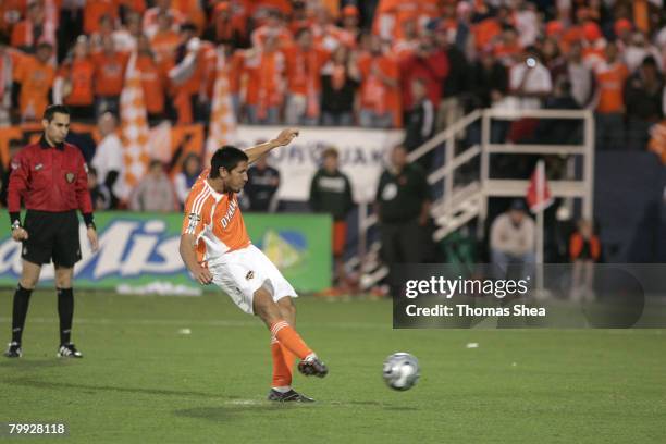Houston's Brian Ching scores his penalty kick during the MLS Cup match between the New England Revolution and the Houston Dynamo at Pizza Hut Park in...