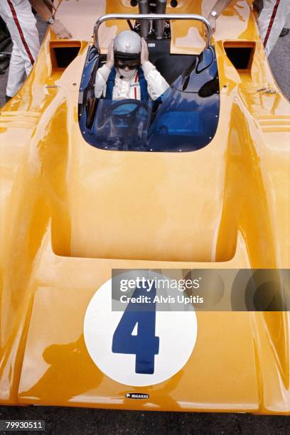 Bruce McClaren sits in his McClaren M8A Can Am car preparing for the Road America race on September 1, 1968 at Elkhart Lake, Wisconsin.