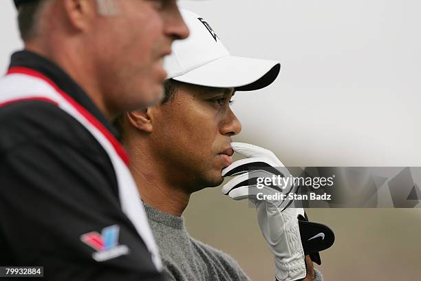 Tiger Woods studies the pin at the 14th green during the third-round matches of the WGC-Accenture Match Play Championship at The Gallery at Dove...