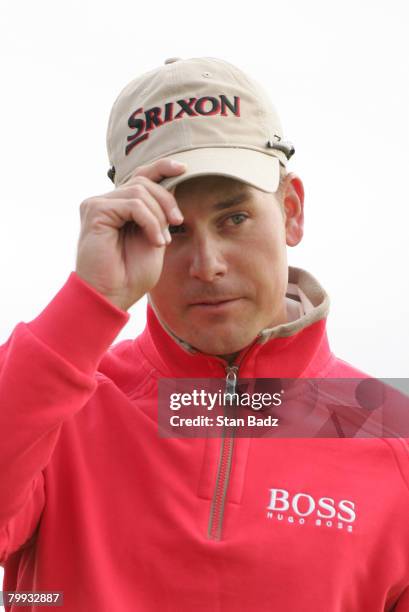 Henrik Stenson tips his cap at the first green during the third-round matches of the WGC-Accenture Match Play Championship at The Gallery at Dove...