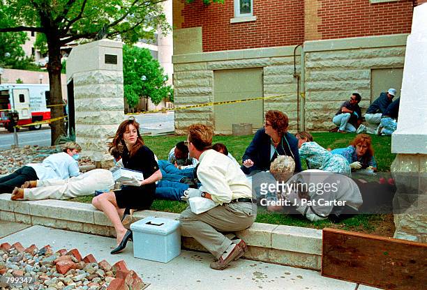 Frightened civilians react to the terrorist bombing at the Alfred P. Murrah Federal Building in Oklahoma City, April 19, 1995 killing 168 people.
