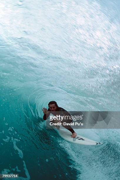 surfing large wave - david puu stock-fotos und bilder