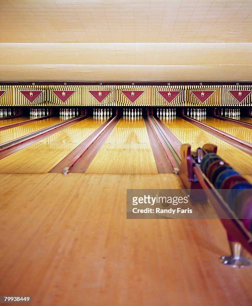 lanes at a bowling alley - bowlingbahn stock-fotos und bilder