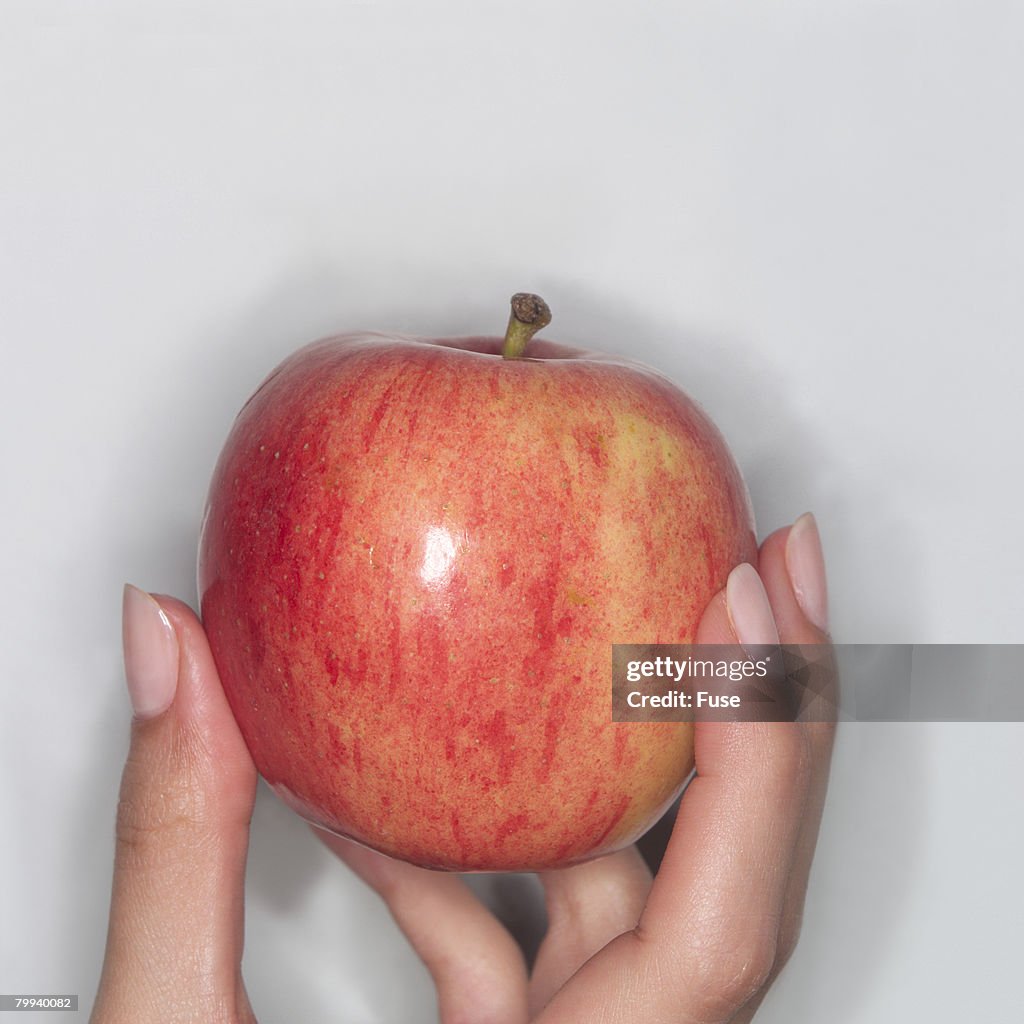 Fingers Holding Apple