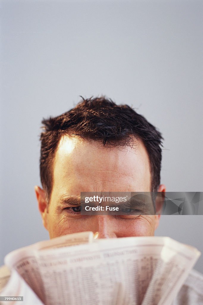 Man Reading Stock Pages