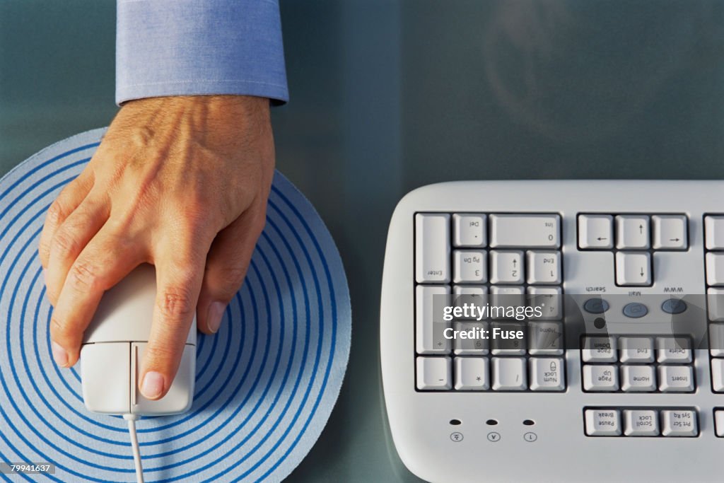 Mans Hand On Computer Mouse High-Res Stock Photo - Getty Images