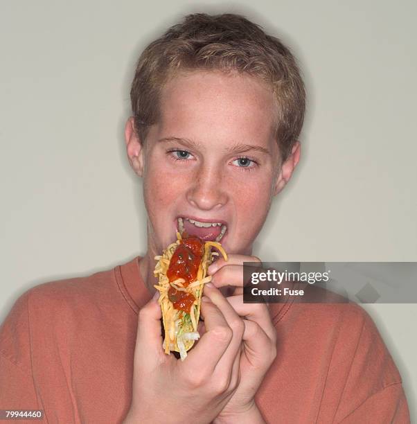 Boy Eating Taco High-Res Stock Photo
