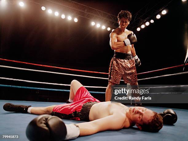 boxer taunting opponent - knockout stock pictures, royalty-free photos & images