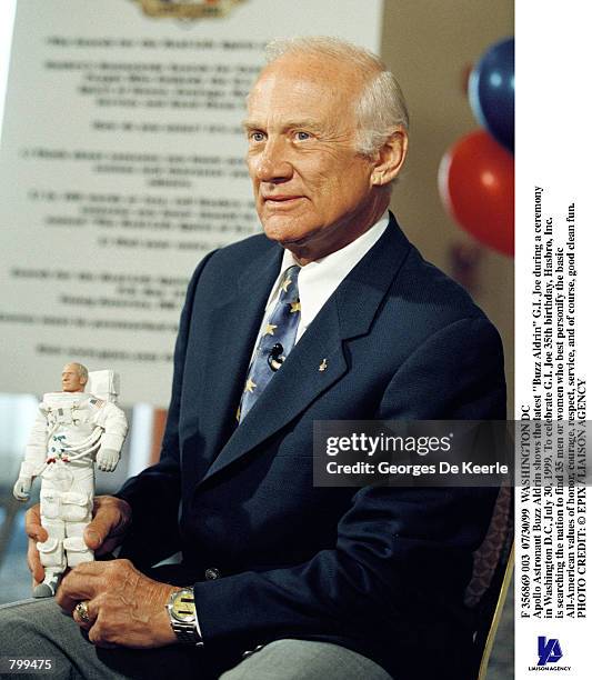 Apollo Astronaut Buzz Aldrin shows the latest "Buzz Aldrin" G.I. Joe during a ceremony in Washington D.C, July 30, 1999. To celebrate G.I. Joe 35th...