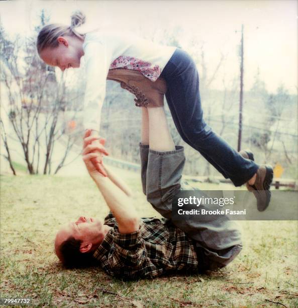 father playing with daughter - brooke fasani stock pictures, royalty-free photos & images