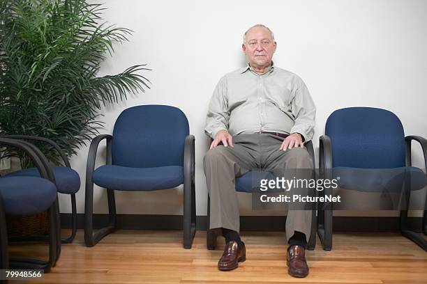senior man in waiting room - waiting room stock pictures, royalty-free photos & images