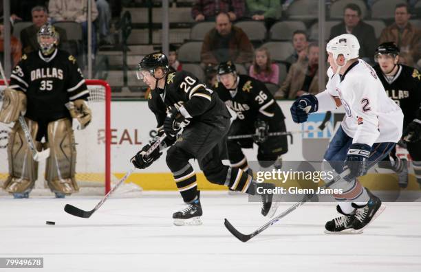 Antti Miettinen of the Dallas Stars moves the puck against Matt Greene of the Edmonton Oilers at the American Airlines Center on February 22, 2008 in...