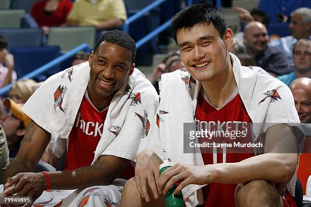 Tracy McGrady and Yao Ming of the Houston Rockets smile on the bench as the Rockets defeated the New Orleans Hornets 100-80 at the New Orleans Arena...