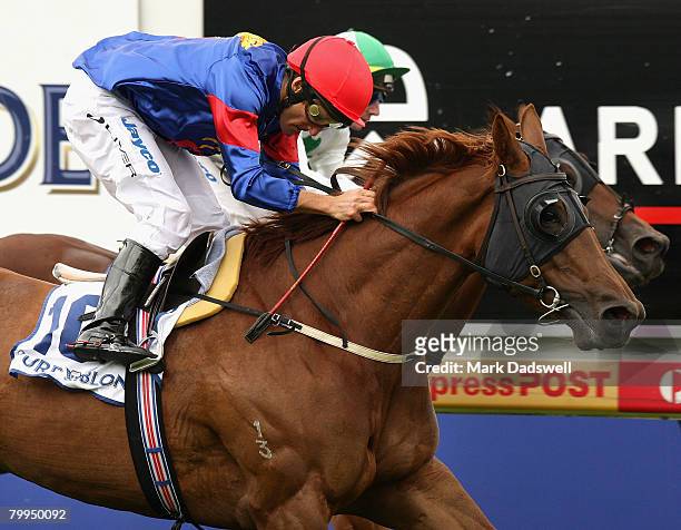 Jockey Damien Oliver riding Princess Coup narrowly wins Race 5 the Pure Blonde St George Stakes from Sirmione ridden by Peter Mertens during the...
