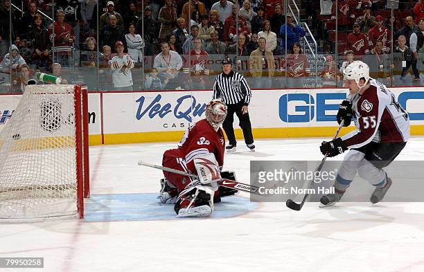 Left Wing Cody McLeod of the Colorado Avalanche scores the game winning shoot out goal against Goaltender Mikael Tellqvist of the Phoenix Coyotes on...
