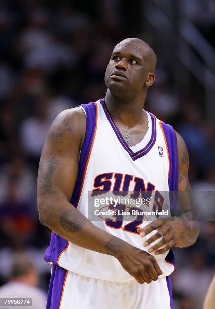 Shaquille O'Neal of the Phoenix Suns looks up at the scoreboard during a game against the Boston Celtics at US Airways Center on February 22, 2008 in...