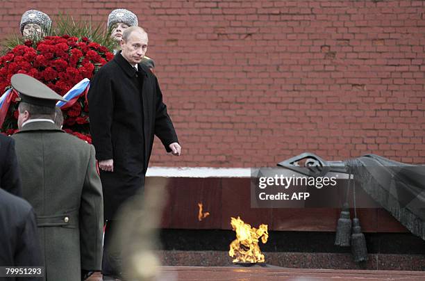 Russian President Vladimir Putin attends a wreath-laying ceremony at the Unkown Soldier's tomb during a national holiday, the Day of the Fatherland's...