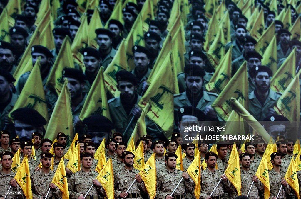 Shiite Muslims Hezbollah militants stand