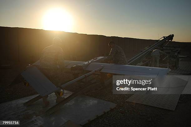 Soldiers with U.S. Army Delta Troop Task Force 2-1 Cavalry prepare to launch a Shadow unmanned aerial vehicle at Forward Operating Base Warhorse...