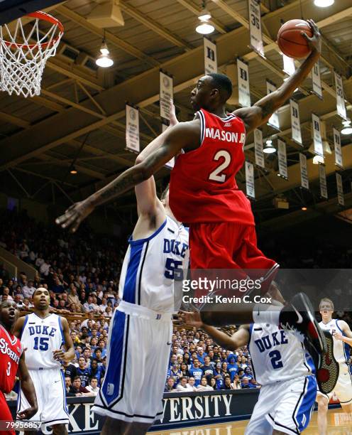 Anthony Mason Jr. #2 of the St. John's Red Storm dunks against Brian Zoubek and Nolan Smith of the Duke Blue Devils during the first half at Cameron...
