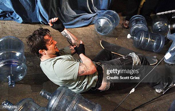 Bam Margera holds his elbow after falling while attempting a stunt during the "Jackassworld: 24 Hour Takeover" to celebrate the launch of...
