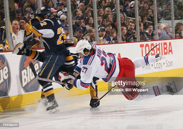 Patrick Kaleta and Adam Mair of the Buffalo Sabres collide with Paul Mara of the New York Rangers on February 23, 2008 at the HSBC Arena in Buffalo,...