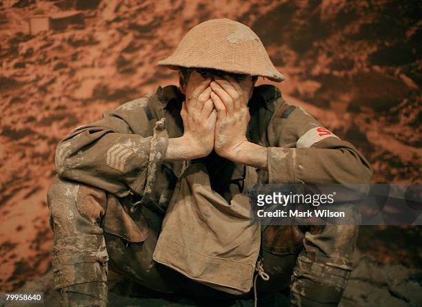 An exhibit showing a soldier experiencing the horrors of war is seen on display as U.S. Secretary of Defense Robert Gates, tours the Australian War...