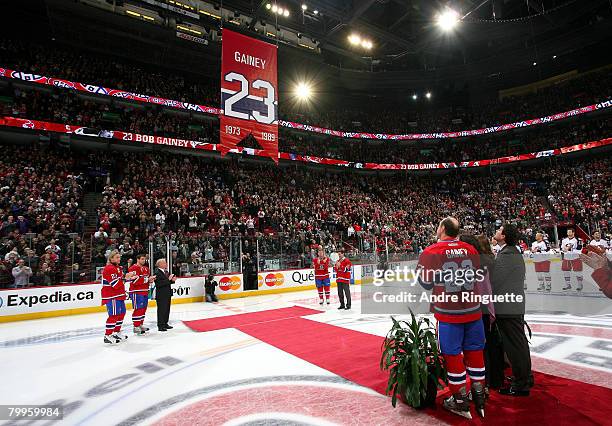Bob Gainey of the Montreal Canadiens watches a banner with his number 23 be raised to the rafters during his jersey retirement ceremony prior to a...