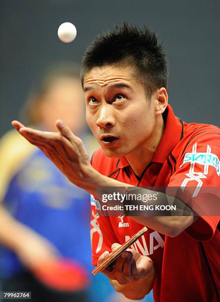 Japan's Kaii Yoshida serves against Slovak's Peter Sereda during the men's preliminaries of the world team table tennis championship in Guangzhou on...