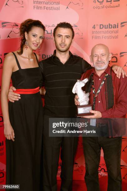 Actor Lotfi Abdelli and director Nouri Bouzid pose backstage with the Silver Muhr Award for the movie 'Making Of', during the 2nd Annual Muhr Awards...