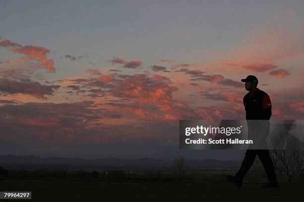 Tiger Woods walks to the practice ground during the Championship match of the WGC-Accenture Match Play Championship at The Gallery at Dove Mountain...