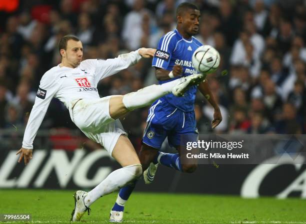 Alan Hutton of Tottenham Hotspur tackles Salomon Kalou of Chelsea during the Carling Cup Final between Tottenham Hotspur and Chelsea at Wembley...