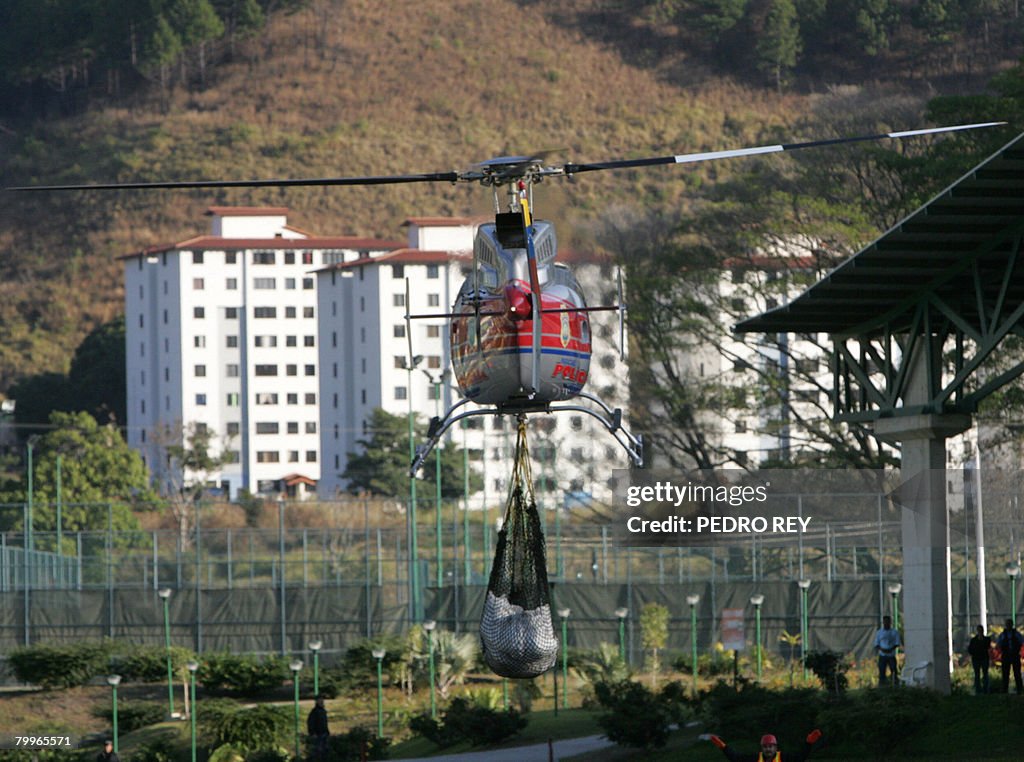 A helicopter transports human remains fr