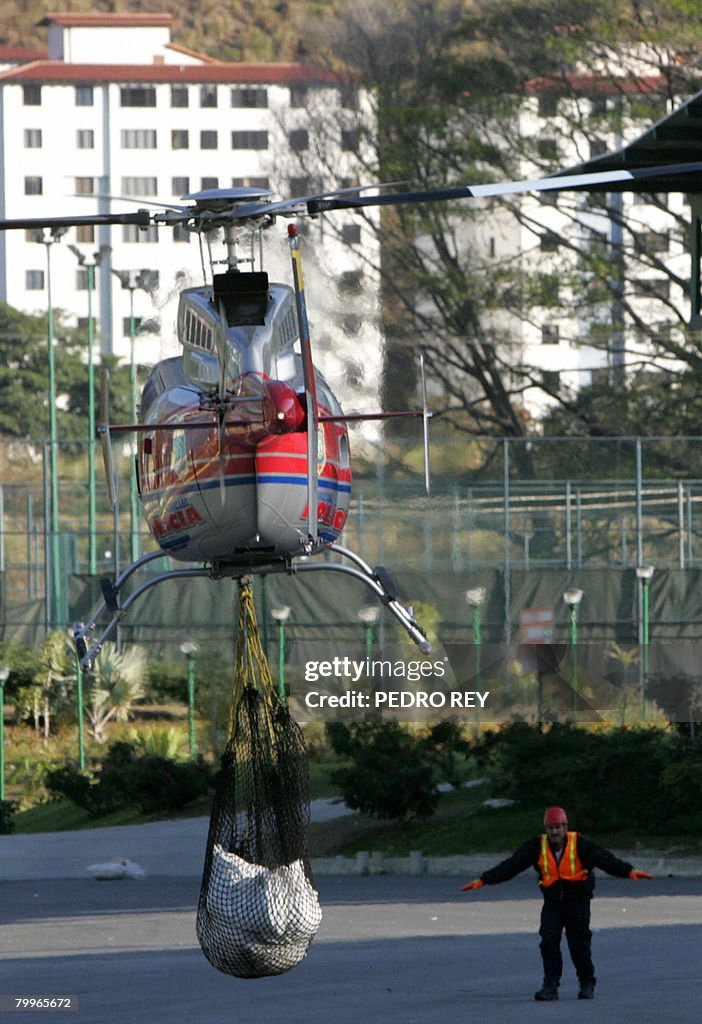 A helicopter transports human remains fr