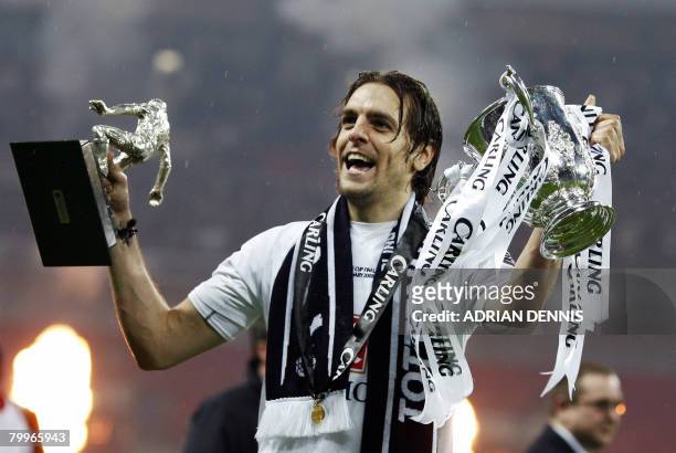 Jonathan Woodgate of Tottenham Hotspur celebrates with his man of the match trophy after winning the Carling Cup Final against Chelsea at Wembley...