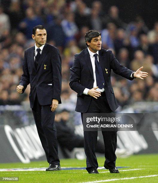 Tottenham Hotspur's Spanish Manager Juande Ramos and Uraguayan Assistant Gus Poyet are pictured during the Carling Cup Final match against Chelsea at...