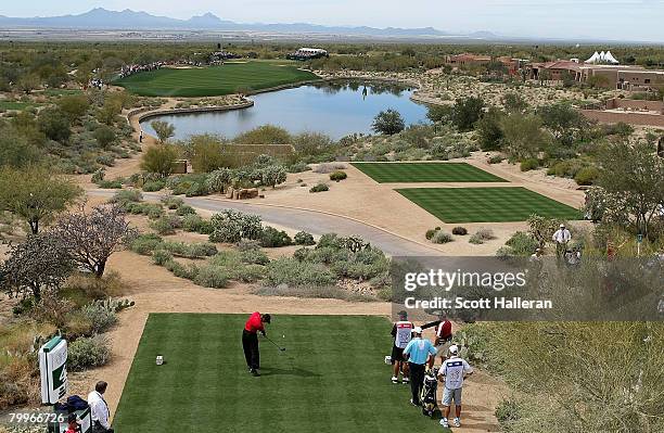 Tiger Woods hits his tee shot on the 22nd hole during the Championship match of the WGC-Accenture Match Play Championship at The Gallery at Dove...