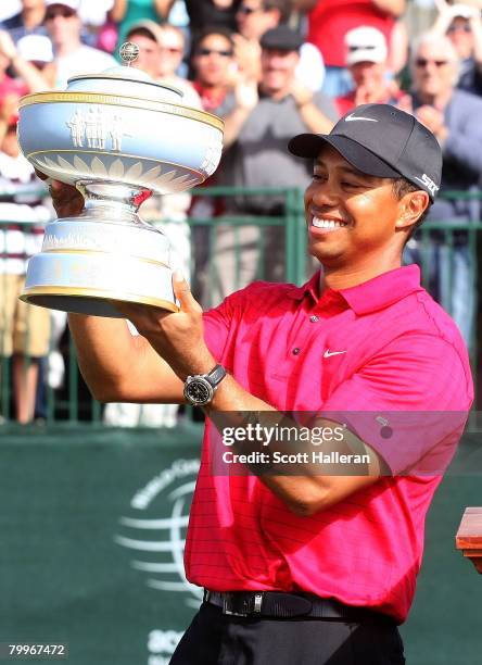Tiger Woods poses with the Walter Hagen Cup after winning the WGC-Accenture Match Play Championship at The Gallery at Dove Mountain on February 24,...