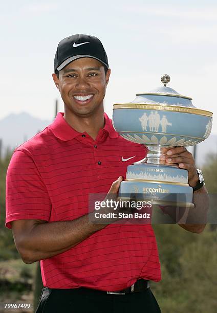 Tiger Woods holds the Walter Hagen Cup after winning the Championship match of the WGC-Accenture Match Play Championship at The Gallery at Dove...