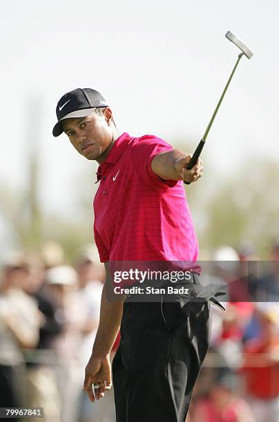 Tiger Woods watches his putt fall short of the cup on the 10th green during the Championship match of the WGC-Accenture Match Play Championship at...