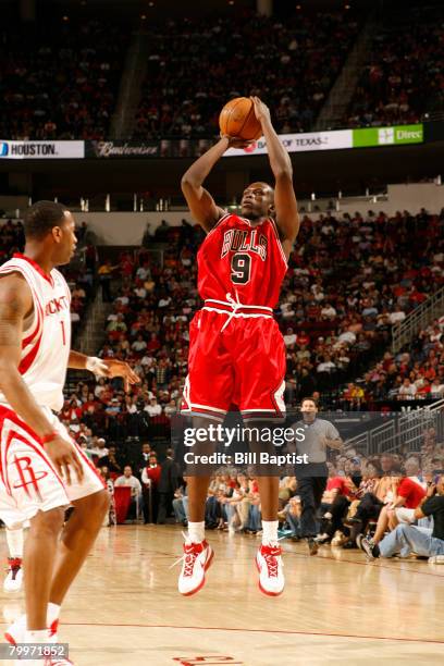 Luol Deng of the Chicago Bulls shoots the ball over Tracy McGrady of the Houston Rockets at the Toyota Center February 24, 2008 in Houston, Texas....